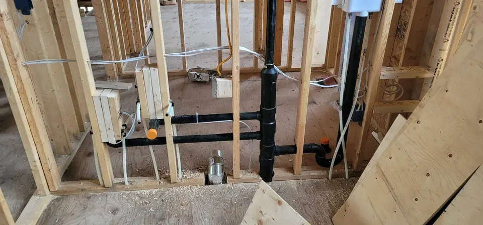 Bathroom drain rough-in in an open wall during a renovation