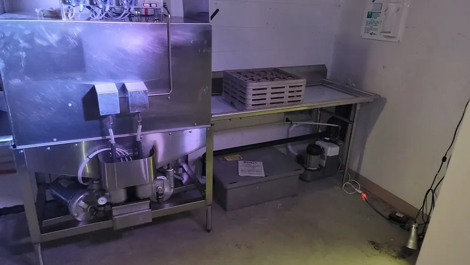 Commercial kitchen dish station plumbed with stainless equipment