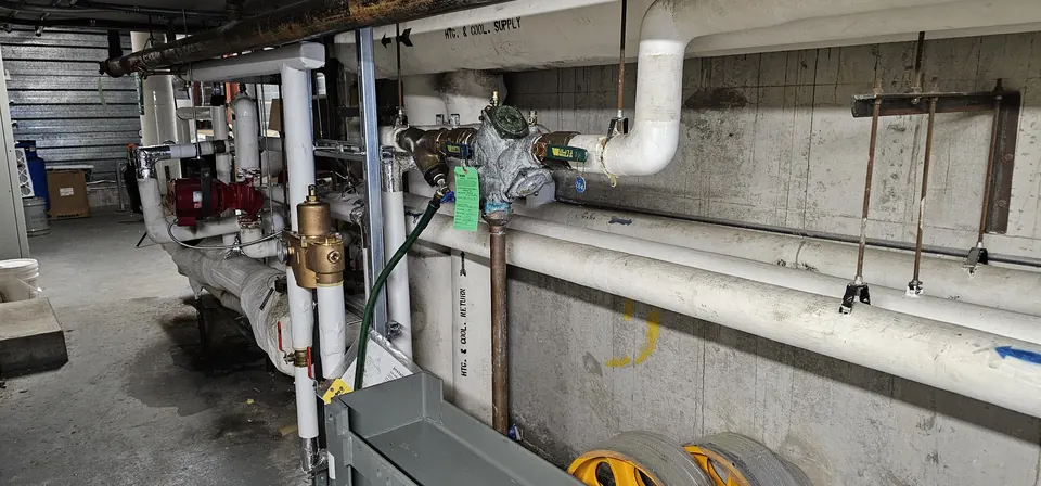 Commercial water service with backflow preventer and valves