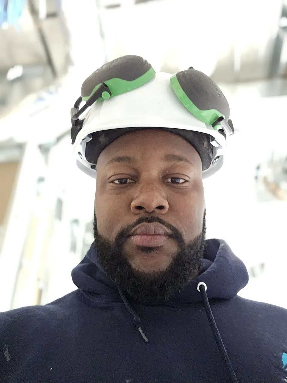 Zain Porter in a hard hat on a job site
